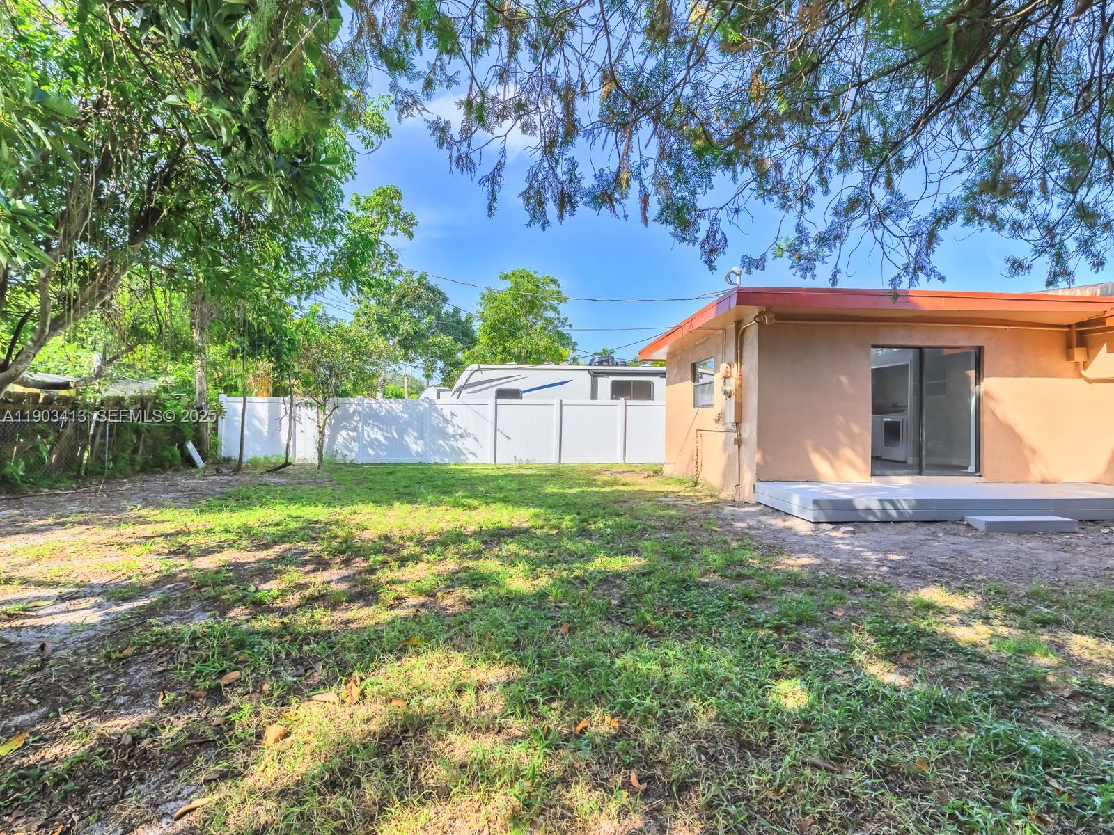 6238 Southwest 24th Street Miramar, FL 33023 - Photo 23 of 33 a view of a house with backyard and garden