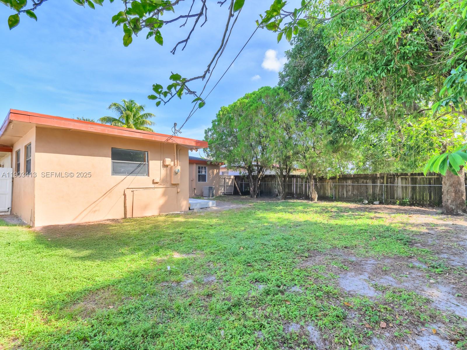 6238 Southwest 24th Street Miramar, FL 33023 - Photo 25 of 33 a view of a backyard with a garden and plants