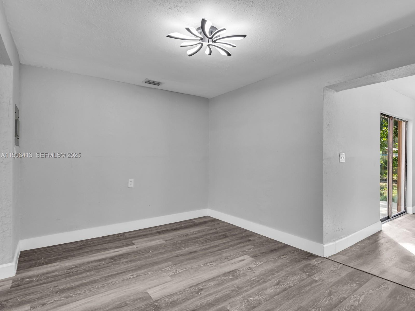 6238 Southwest 24th Street Miramar, FL 33023 - Photo 8 of 33 wooden floor in an empty room