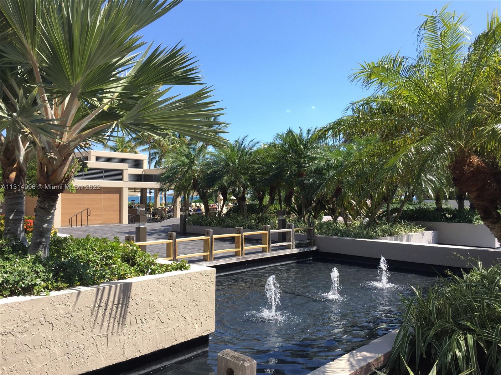 151 Crandon Boulevard, Unit 439 Key Biscayne, FL 33149 - Photo 14 of 24 a view of a swimming pool with a patio
