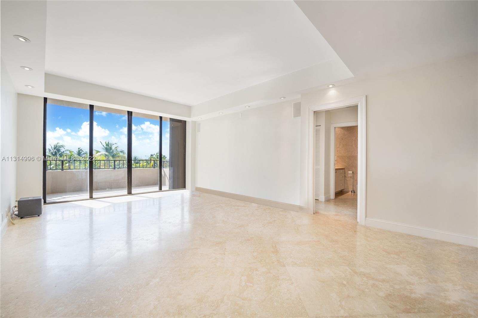 151 Crandon Boulevard, Unit 439 Key Biscayne, FL 33149 - Photo 3 of 24 a view of an empty room with glass door