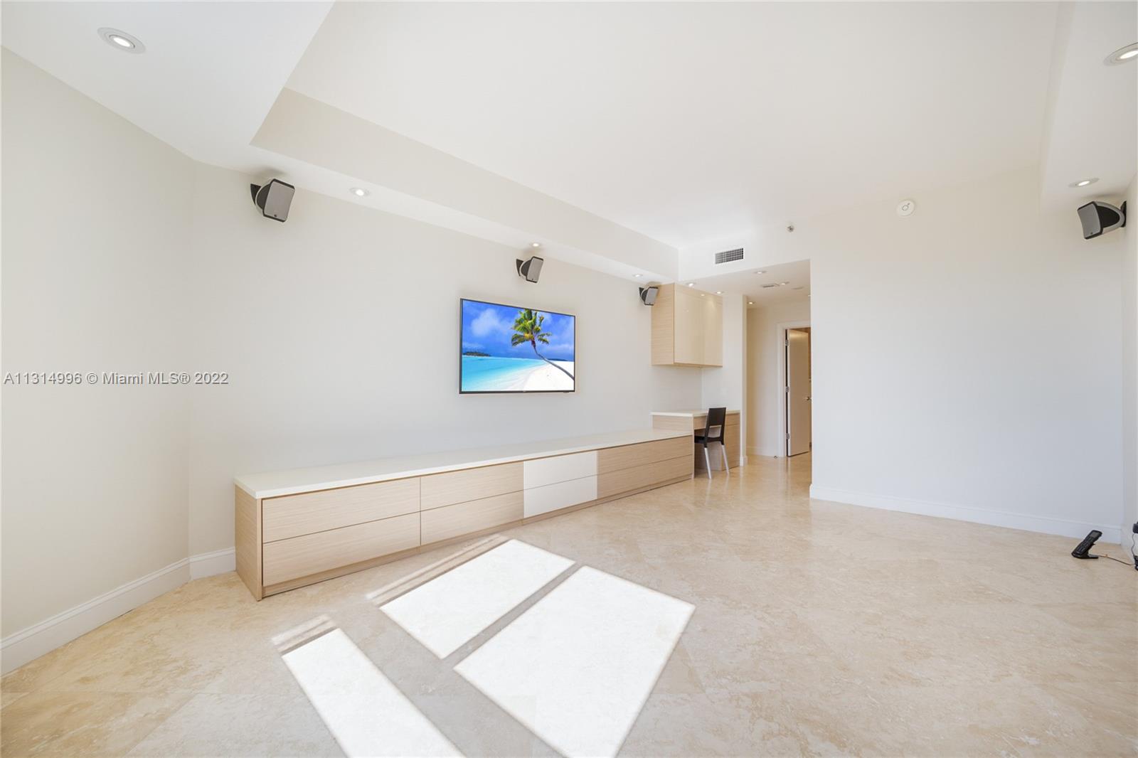 151 Crandon Boulevard, Unit 439 Key Biscayne, FL 33149 - Photo 8 of 24 a living room with furniture and a table