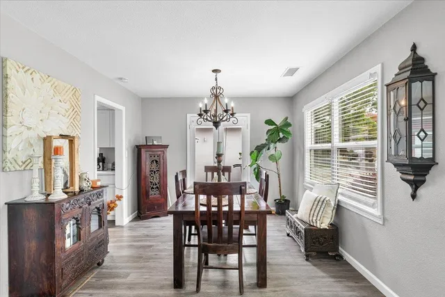 a view of a dining room with furniture window and outside view