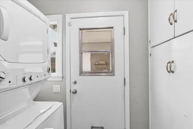 a bathroom with a toilet sink vanity and mirror