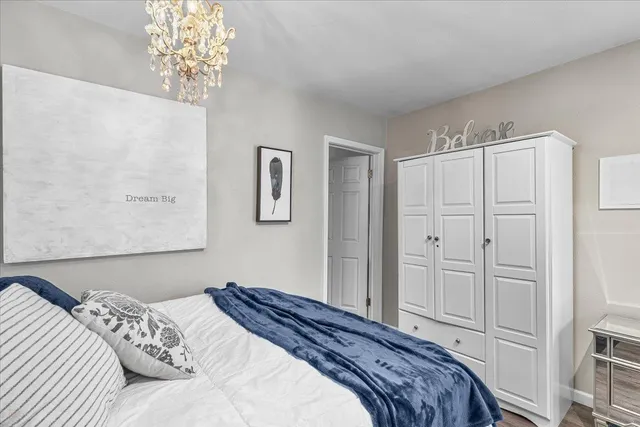 a living room with furniture a window and wooden floor