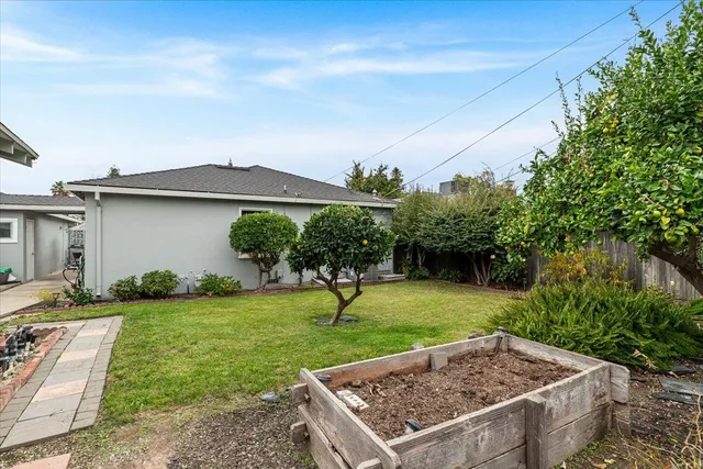 a view of a table and chairs in the garden