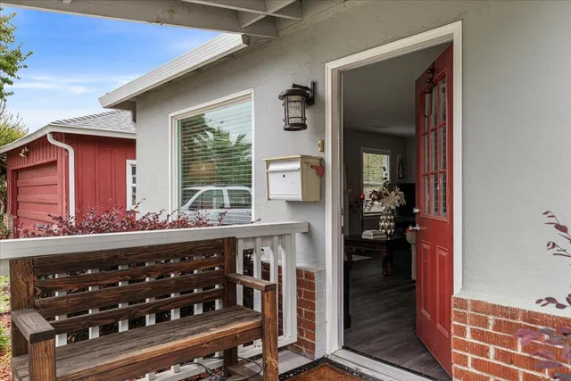 a view of a wooden door and a wooden bench in a room