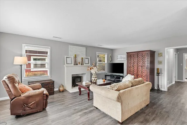 a living room with furniture and a fireplace