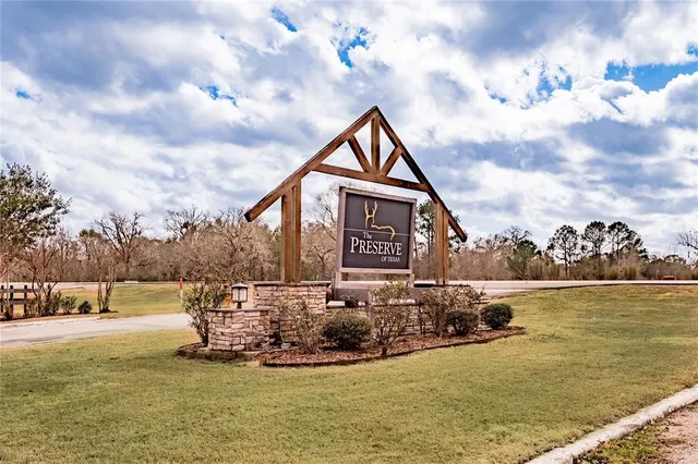 a view of a lake with a house in the background