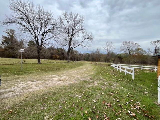 Lot 305 Trinity Drive Cleveland, TX 77327 - Photo 5 of 11 a view of outdoor space with deck and yard