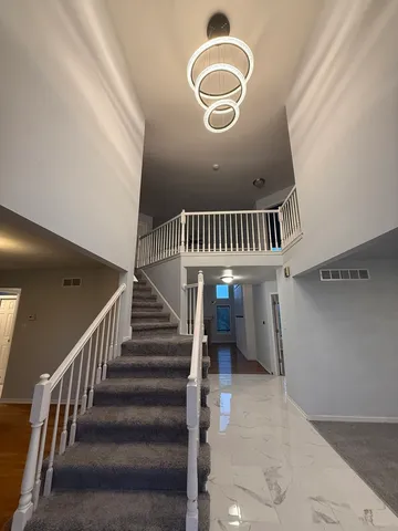 a view of a livingroom with a staircase