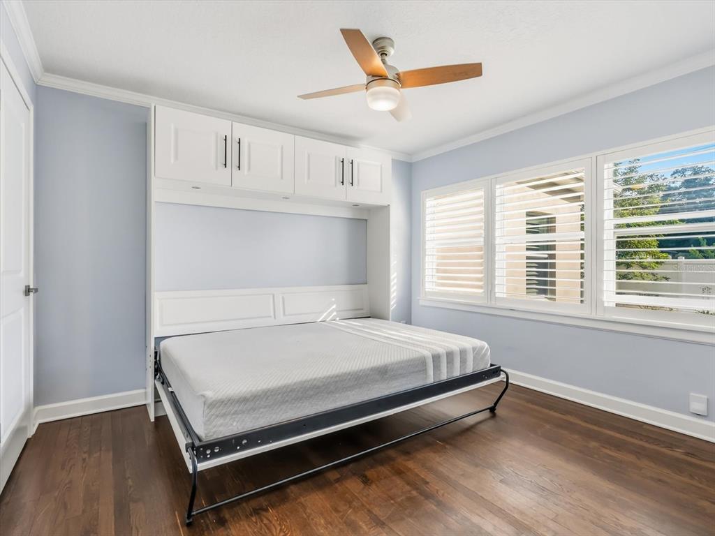 2330 Hickory Lane Orlando, FL 32803 - Photo 23 of 30 a bed sitting in a bedroom next to a window