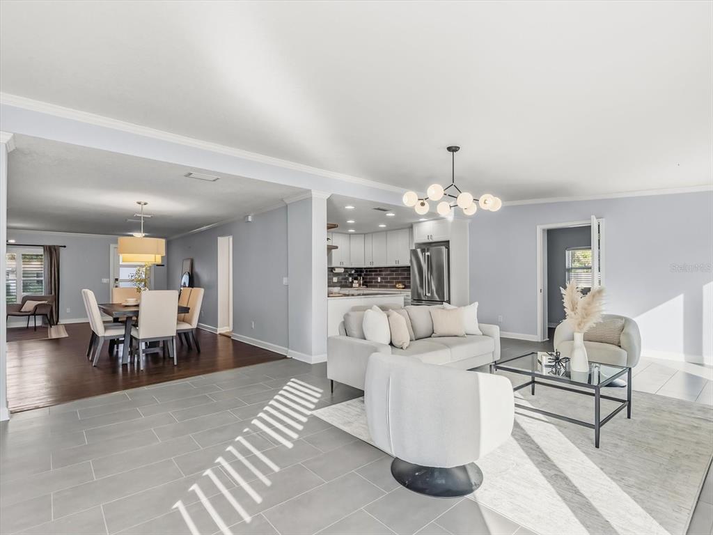2330 Hickory Lane Orlando, FL 32803 - Photo 9 of 30 a living room with furniture and a chandelier