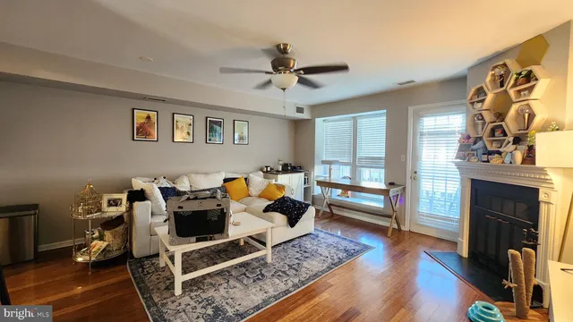a bedroom with furniture and wooden floor