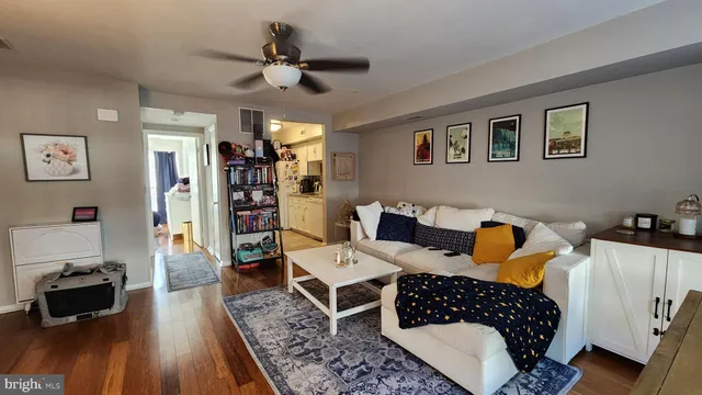 a bedroom with furniture and a flat screen tv