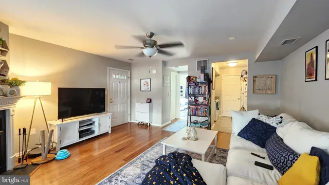 a view of an entryway with wooden floor