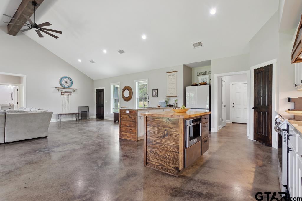 15767 County Road 285 Tyler, TX 75707 - Photo 12 of 44 a view of living room kitchen with stainless steel appliances cabinets