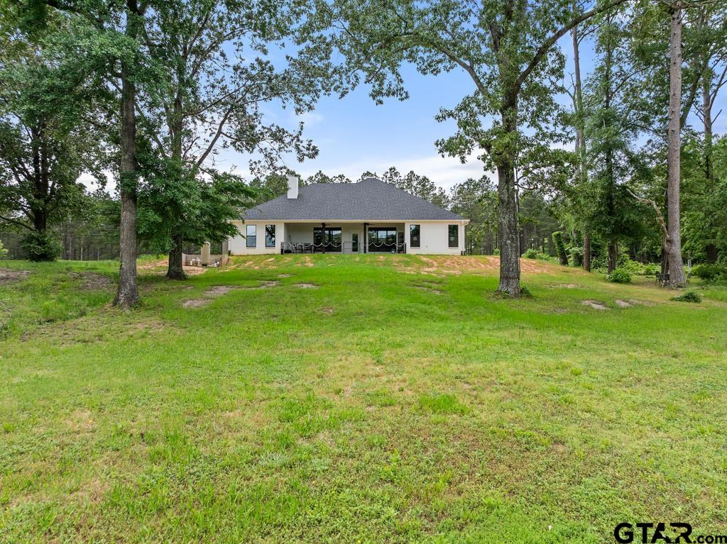15767 County Road 285 Tyler, TX 75707 - Photo 13 of 44 a front view of a house with a yard