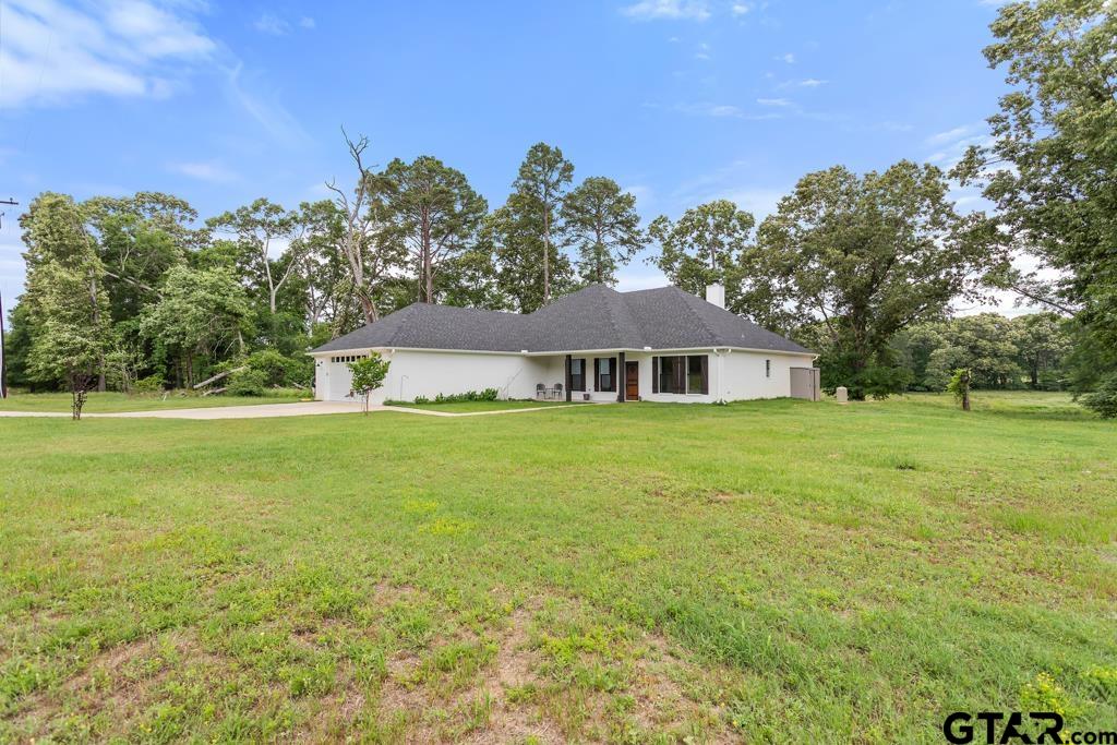 15767 County Road 285 Tyler, TX 75707 - Photo 15 of 44 a front view of a house with yard and green space