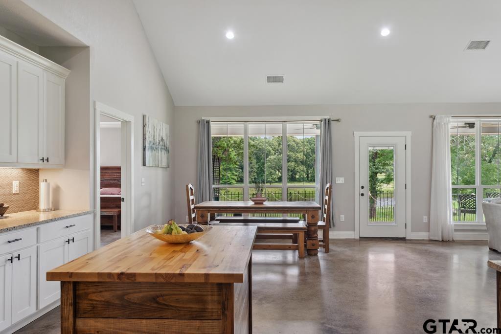 15767 County Road 285 Tyler, TX 75707 - Photo 17 of 44 a view of a dining room with furniture window and wooden floor
