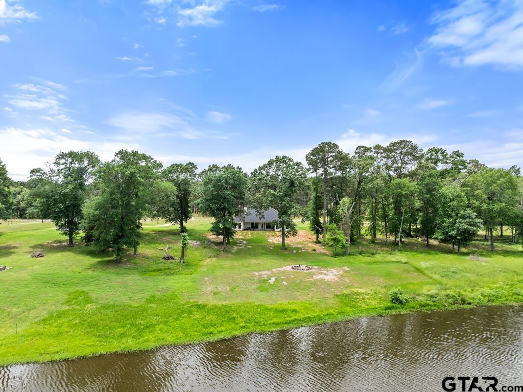 15767 County Road 285 Tyler, TX 75707 - Photo 21 of 44 a backyard of a house with a yard and outdoor seating
