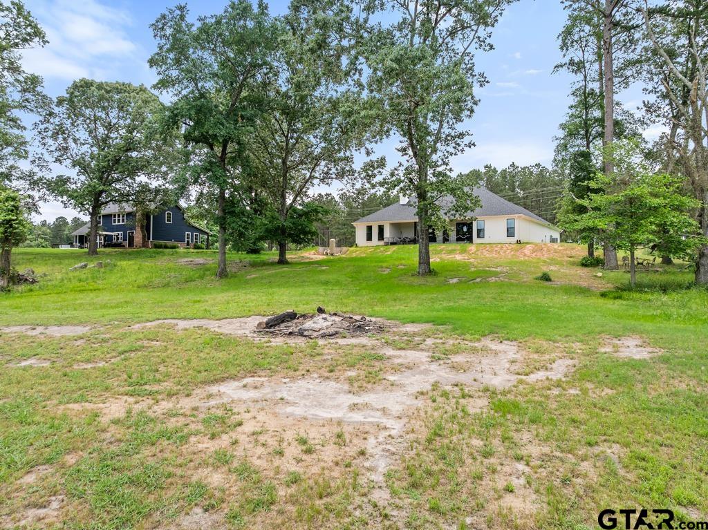 15767 County Road 285 Tyler, TX 75707 - Photo 27 of 44 a view of a house with a big yard and large trees
