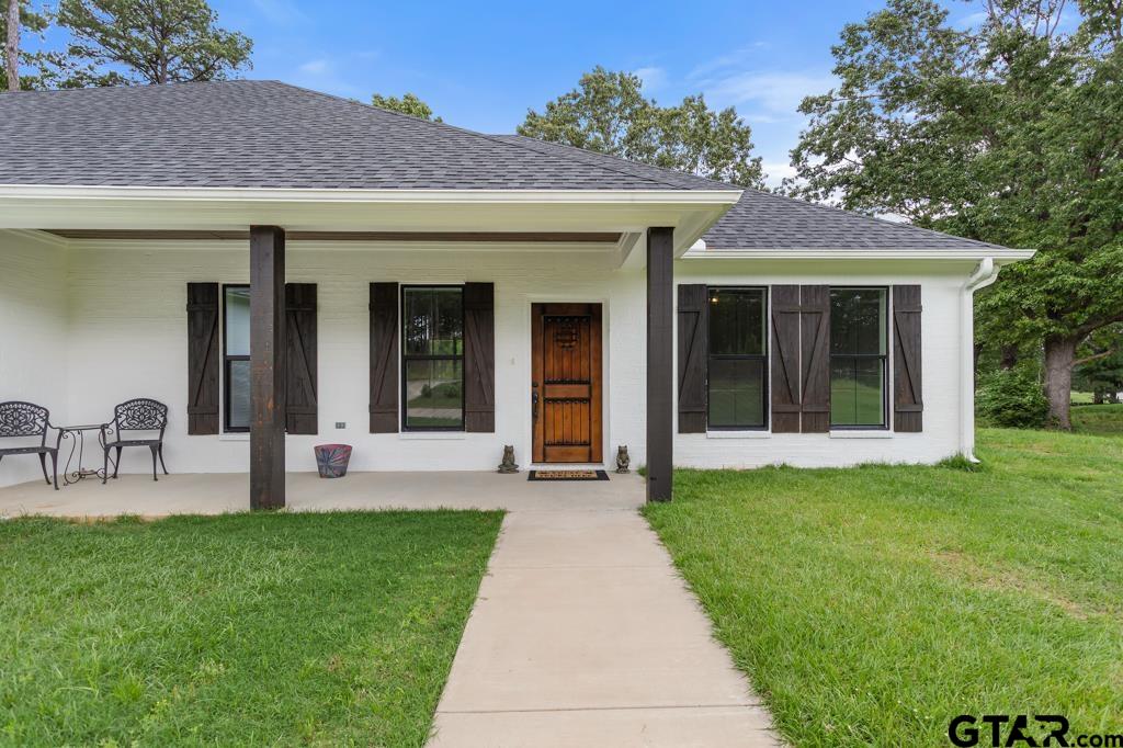 15767 County Road 285 Tyler, TX 75707 - Photo 3 of 44 a front view of a house with garden