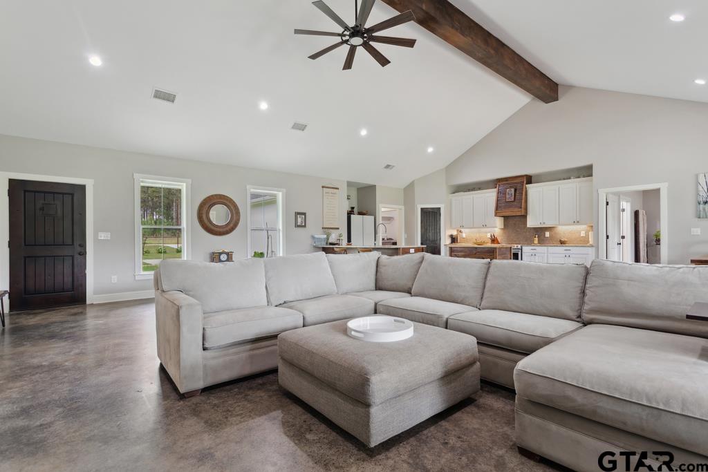 15767 County Road 285 Tyler, TX 75707 - Photo 34 of 44 a living room with furniture and a clock