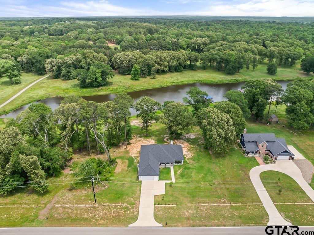 15767 County Road 285 Tyler, TX 75707 - Photo 35 of 44 a view of a lake with a yard