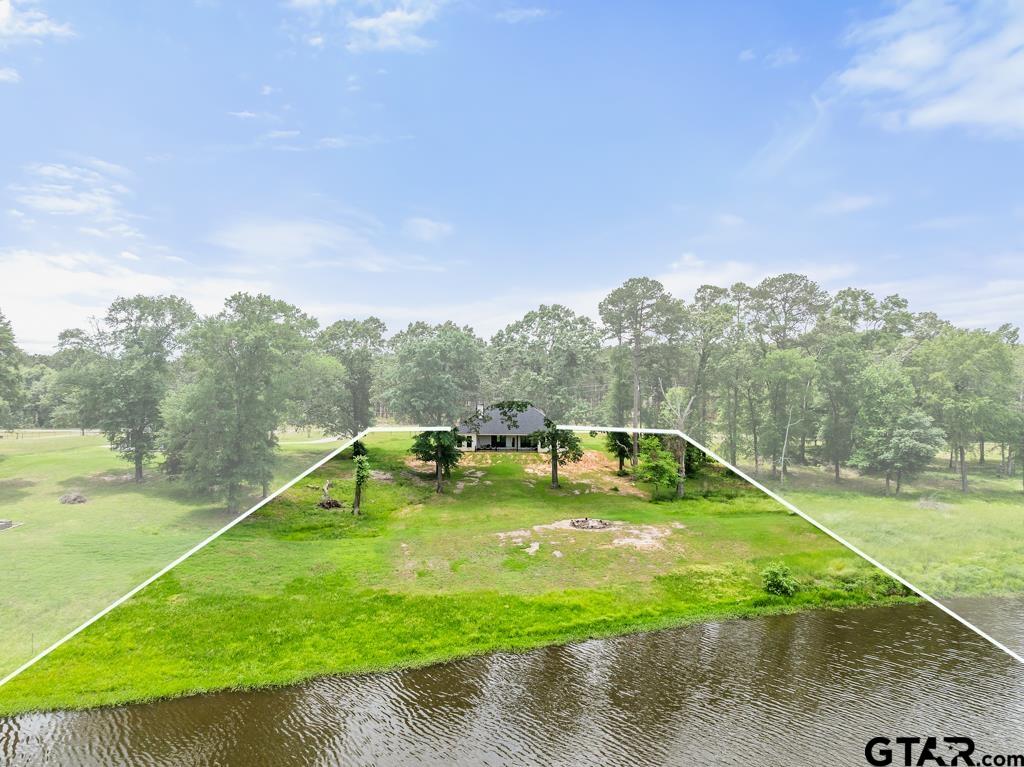 15767 County Road 285 Tyler, TX 75707 - Photo 36 of 44 a view of a swimming pool with a yard and a fountain