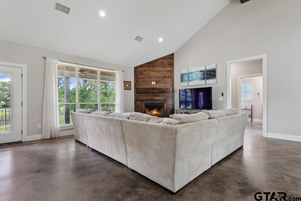 15767 County Road 285 Tyler, TX 75707 - Photo 8 of 44 a living room with furniture and a fireplace