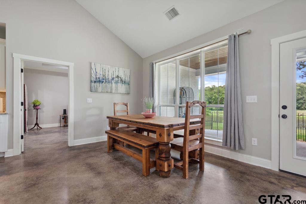 15767 County Road 285 Tyler, TX 75707 - Photo 10 of 44 a dining room with furniture and wooden floor
