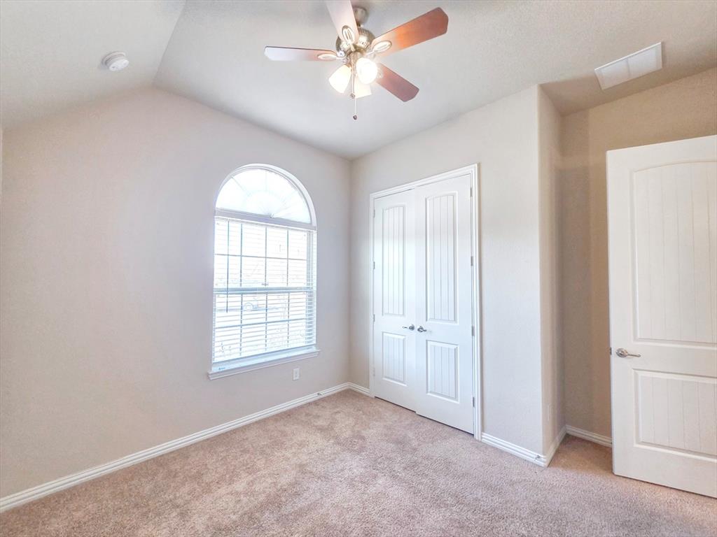 355 Prairie Ridge Lane Lewisville, TX 75056 - Photo 12 of 24 a view of an empty room with a window