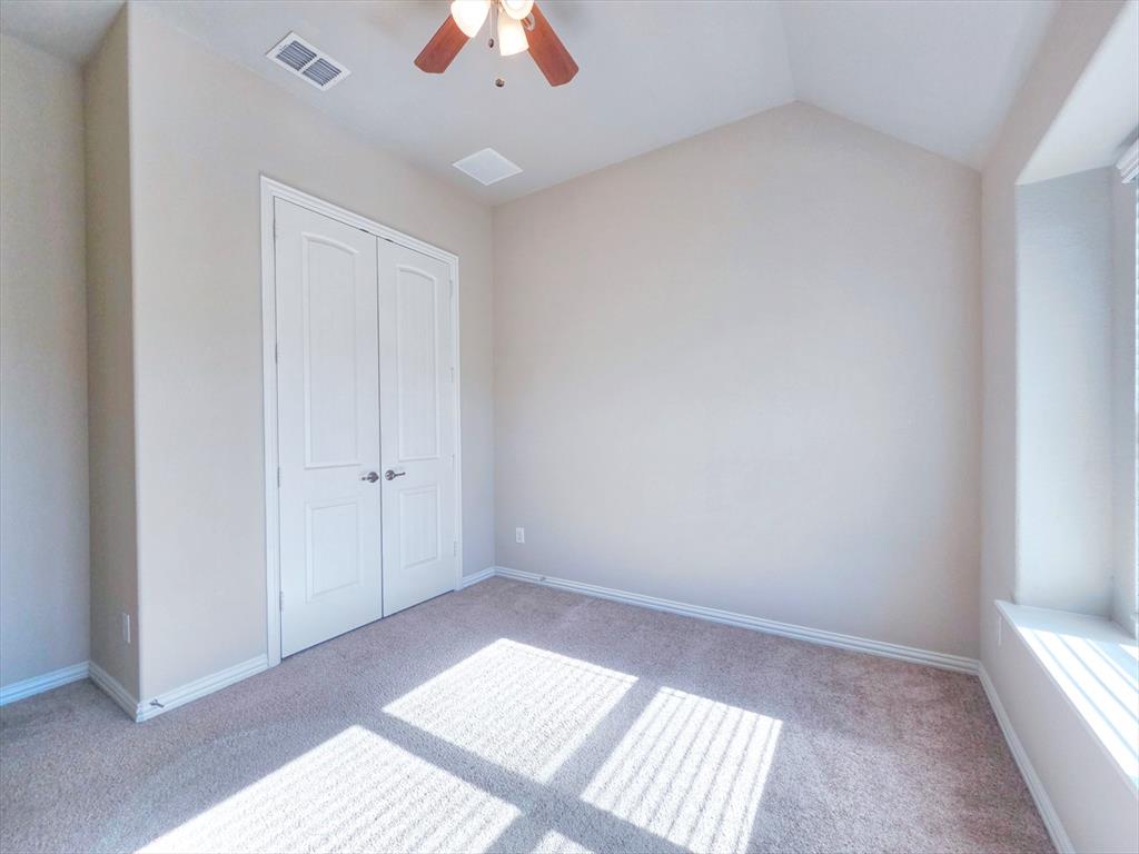 355 Prairie Ridge Lane Lewisville, TX 75056 - Photo 13 of 24 a view of an empty room and window