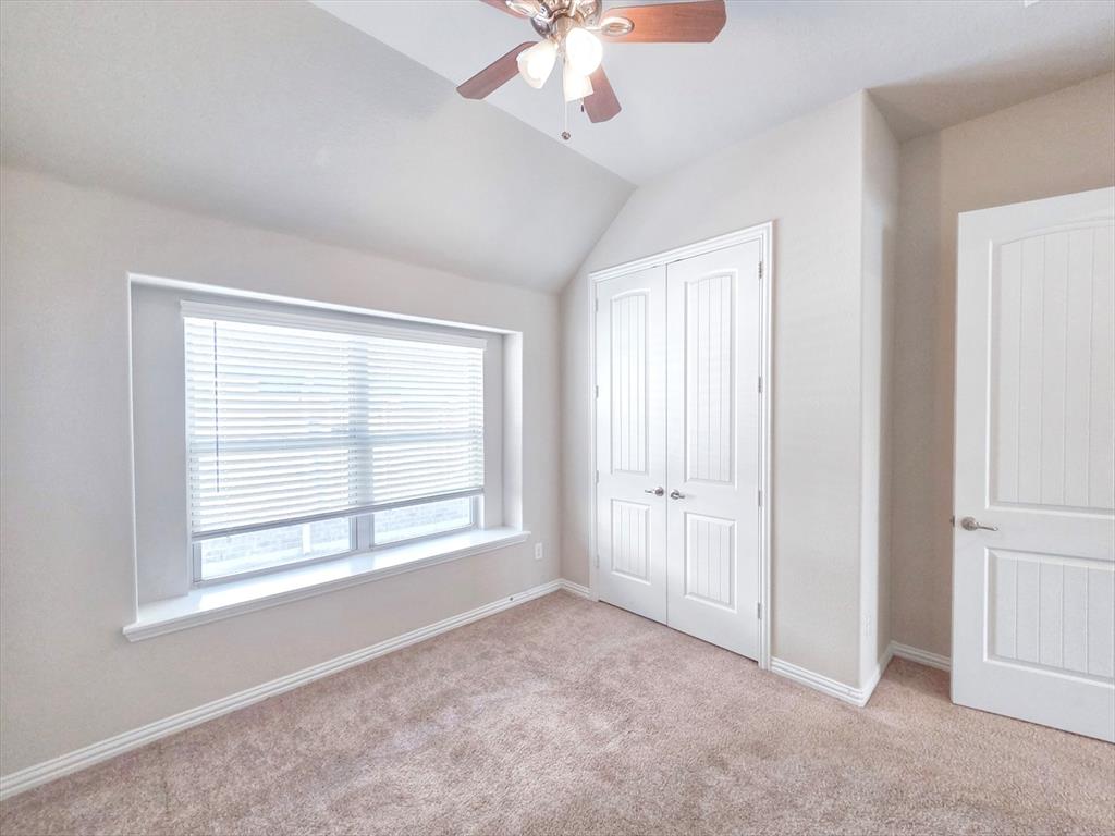 355 Prairie Ridge Lane Lewisville, TX 75056 - Photo 14 of 24 a view of an empty room with a window