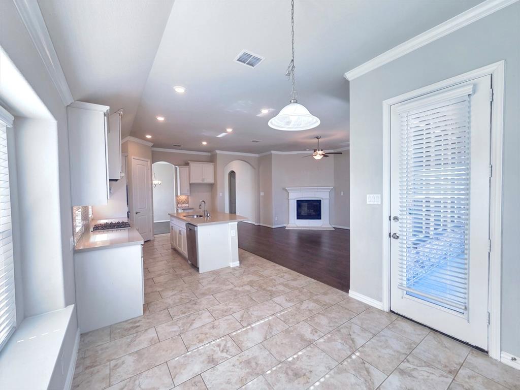 355 Prairie Ridge Lane Lewisville, TX 75056 - Photo 8 of 24 a view of a kitchen with furniture and a window