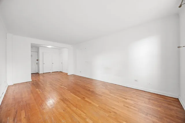 a picture of a bathroom with a shower