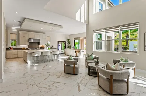 a kitchen with counter top space a sink a stove and cabinets