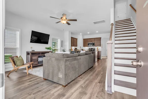 a living room with furniture and a flat screen tv