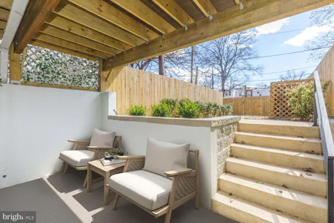 a bathroom with a granite countertop sink vanity and mirror