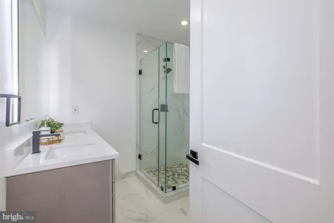 a bedroom with bed and wall painting