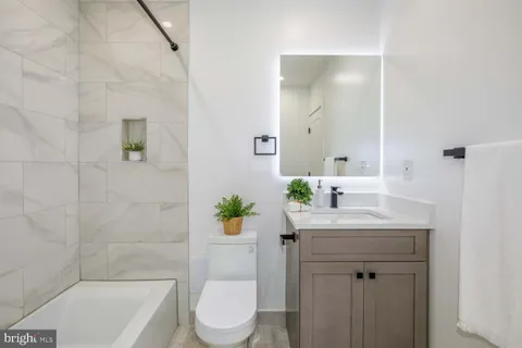 a bedroom with a bed and a table