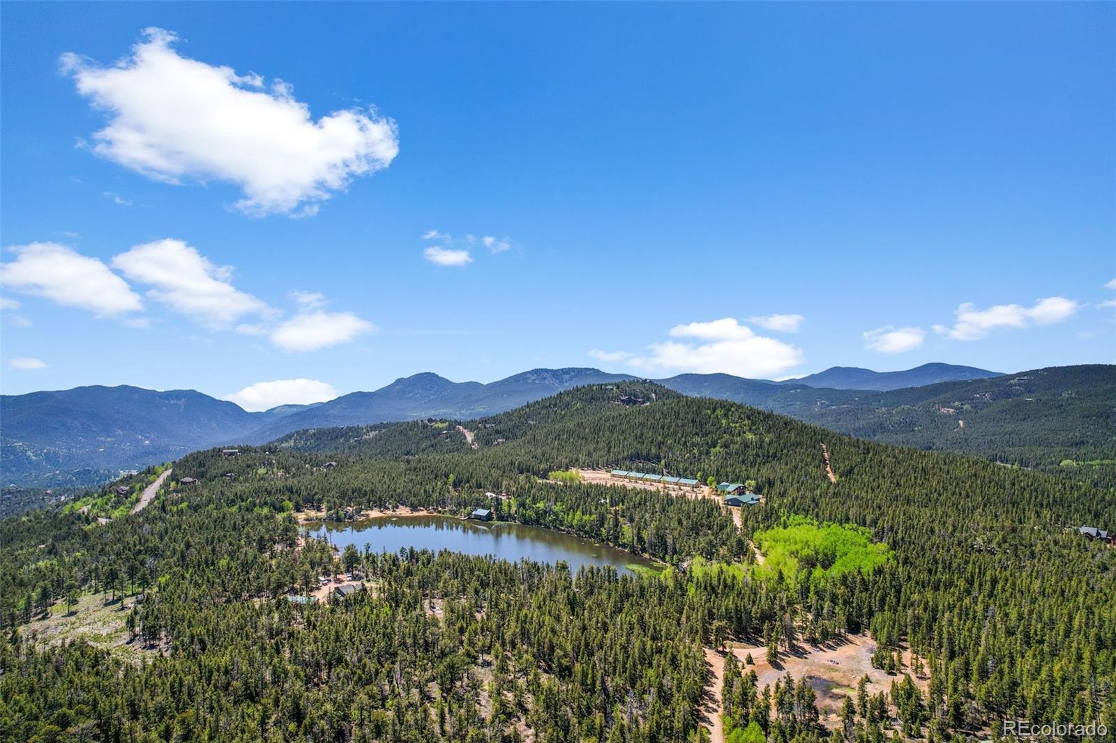 900 Rudi Lane Golden, CO 80403 - Photo 8 of 21 a view of a lake with mountains in the background
