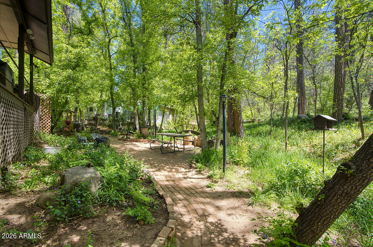387 West Columbine Road Payson, AZ 85541 - Photo 32 of 40 Brick Path Through Grounds