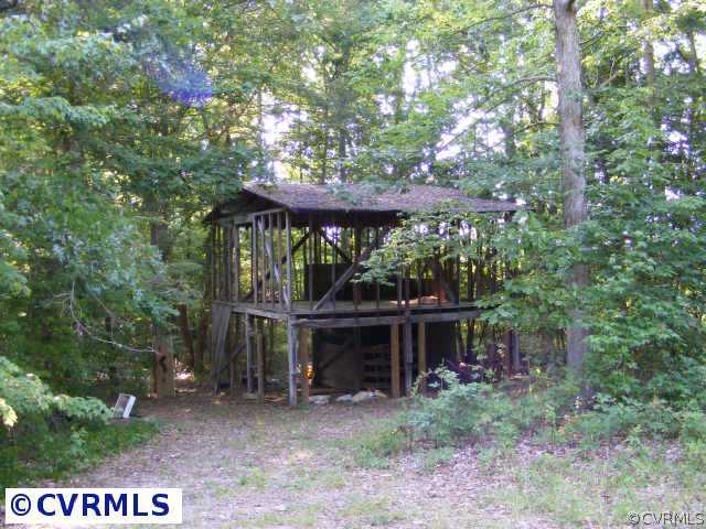 13410 Scotts Road Dewitt, VA 23840 - Photo 5 of 9 a view of a wooden deck with a tree