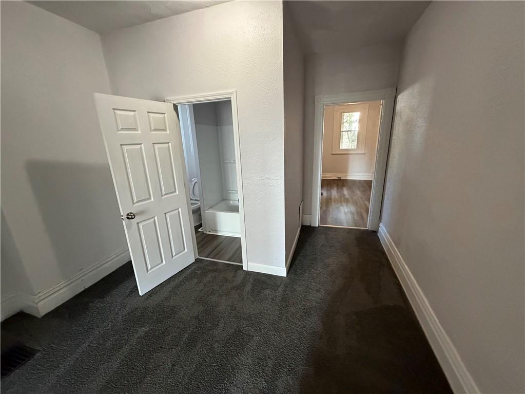 7709 Bennett Street, Unit 1 Pittsburgh, PA 15208 - Photo 4 of 6 a view of a room with stairs