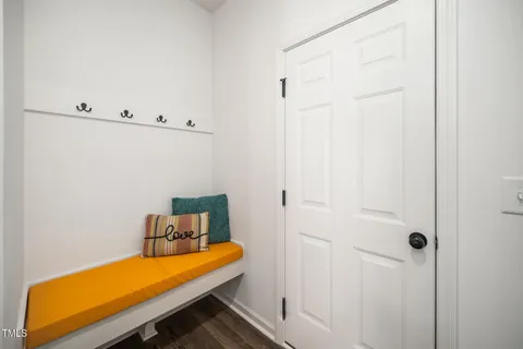 a room with a bed and painted walls