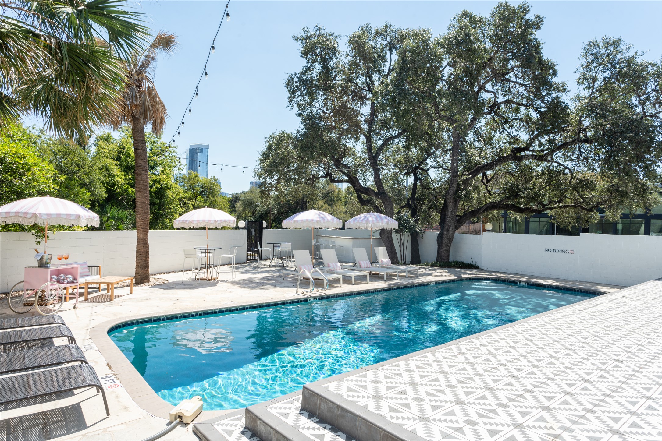 1200 Enfield Road, Unit 205 Austin, TX 78703 - Photo 19 of 20 a view of a backyard with chairs and potted plants