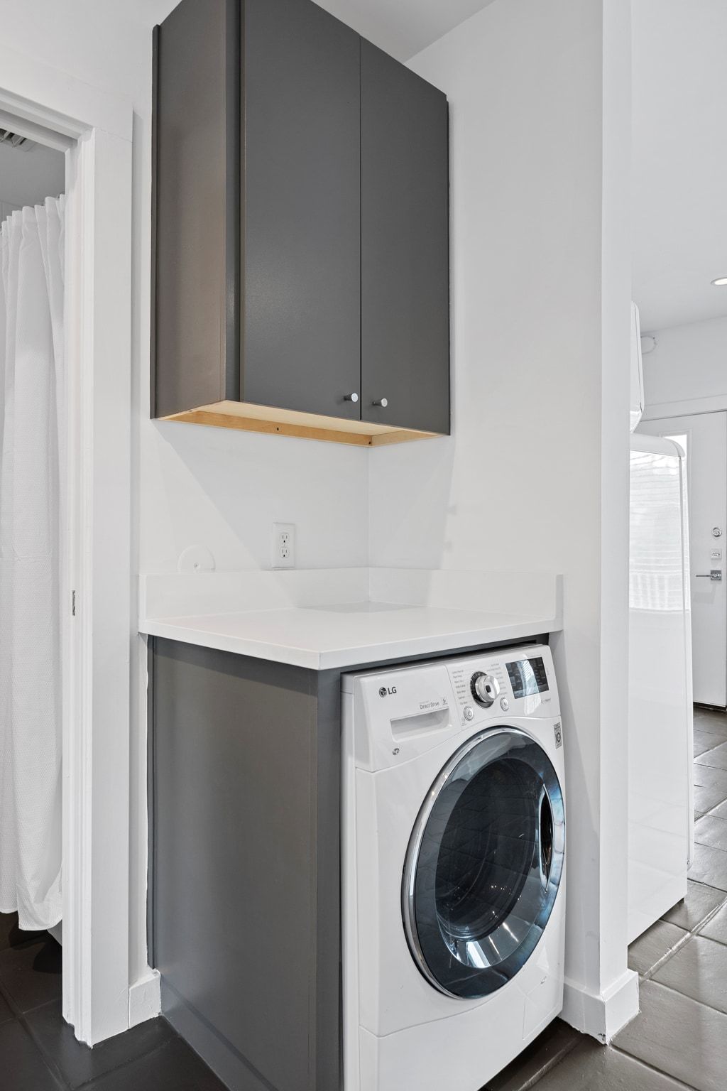 1200 Enfield Road, Unit 205 Austin, TX 78703 - Photo 9 of 22 a utility room with dryer and washer