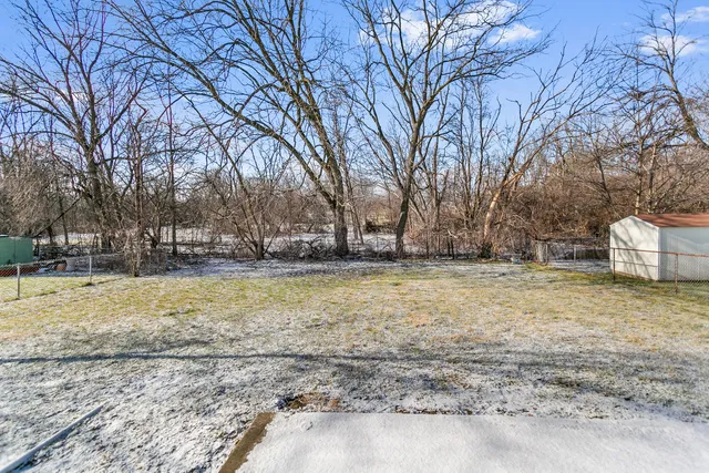 a view of outdoor space with deck and tree
